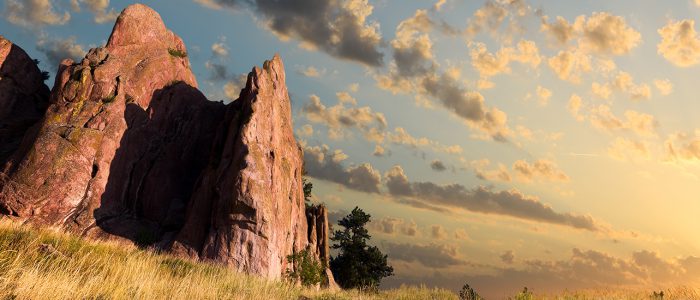 Dawn over Red Rocks and grass fields in Boulder CO