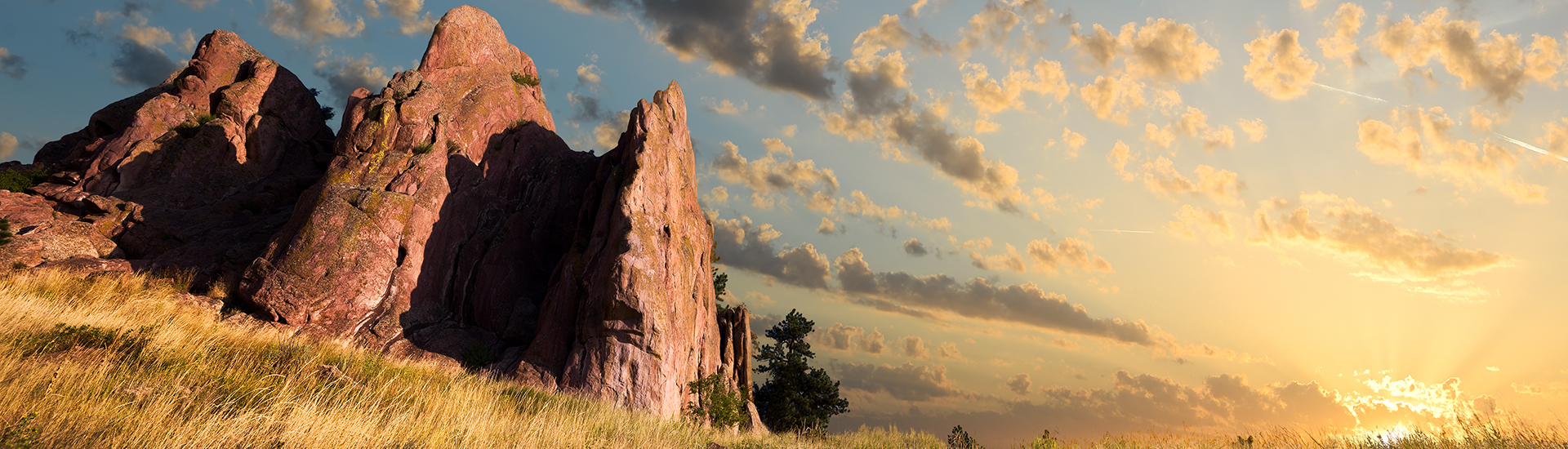 Dawn over Red Rocks and grass fields in Boulder CO