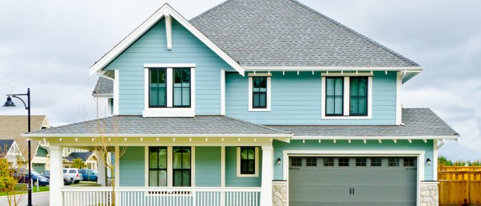 Beautiful blue home in neighborhood in the spring