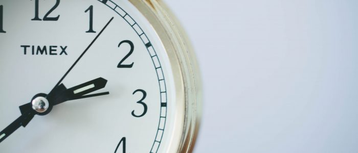 Half of a clock zoomed in on the face