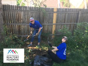 Members of CAR and Colorado Association of REALTORS Foundation helped serve a homeowner in the community with fixing their fence.