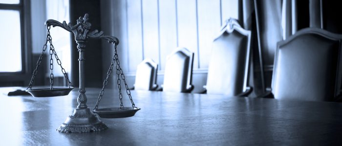 Symbol of law and justice in the empty courtroom law and justice concept BLUE TONE