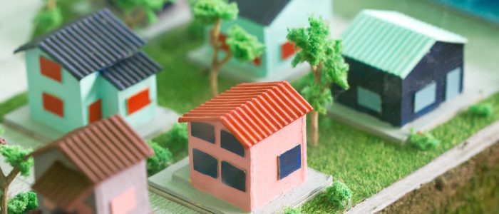 Small Homes And Trees Models On Grass.