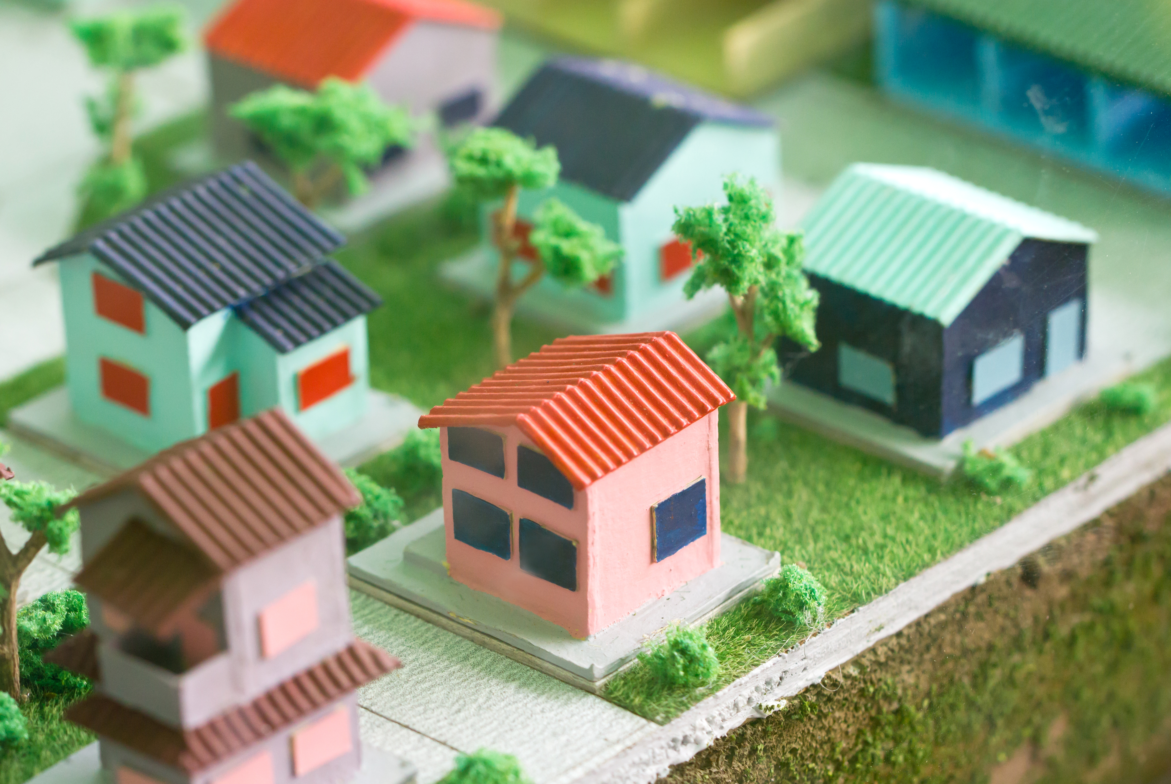 Small Homes And Trees Models On Grass.