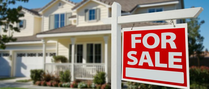 Home For Sale Real Estate Sign in Front of New House.