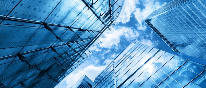Modern business skyscrapers, high-rise buildings, architecture raising to the sky, sun. Concepts of financial, economics, future etc.