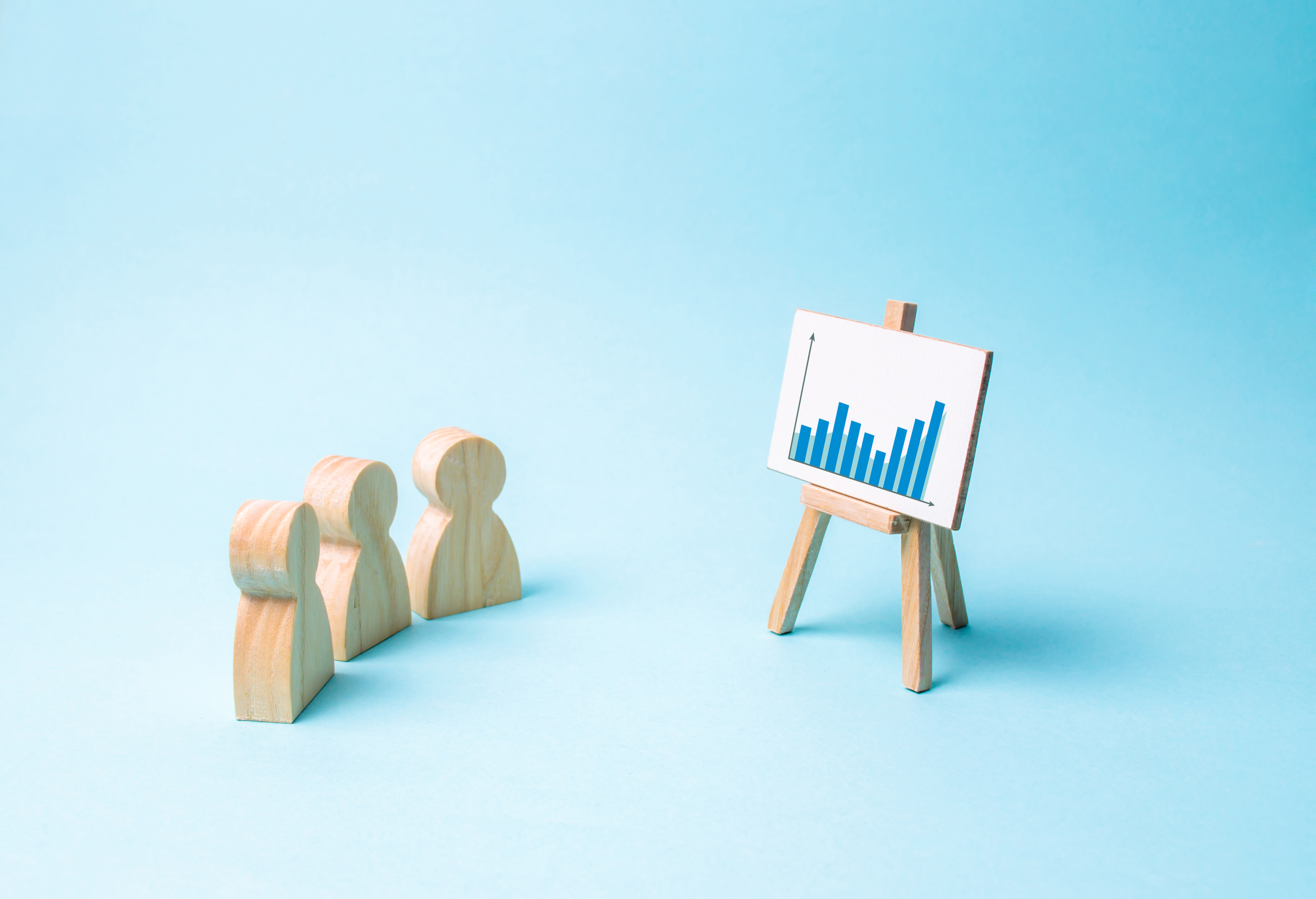 Three people look at the statistics and discuss business strategy and plans for the development of the company. Analysis of the results, familiarization with information, market analysis and marketing