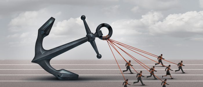 Business group challenge as a team of workers pulling a heavy anchor together as a corporate metaphor for overcoming the burden and obstacles of a company with 3D illustration elements.