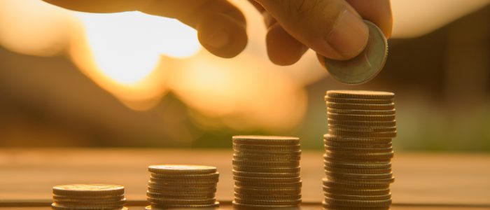 Saving money concept preset by Male hand putting money coin stack growing business. money finance coins money stacks savings money save cost saving